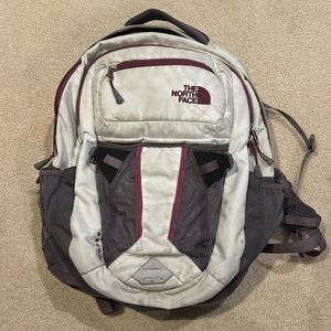 North face backpack with computer pocket inside and extra pockets on outside.